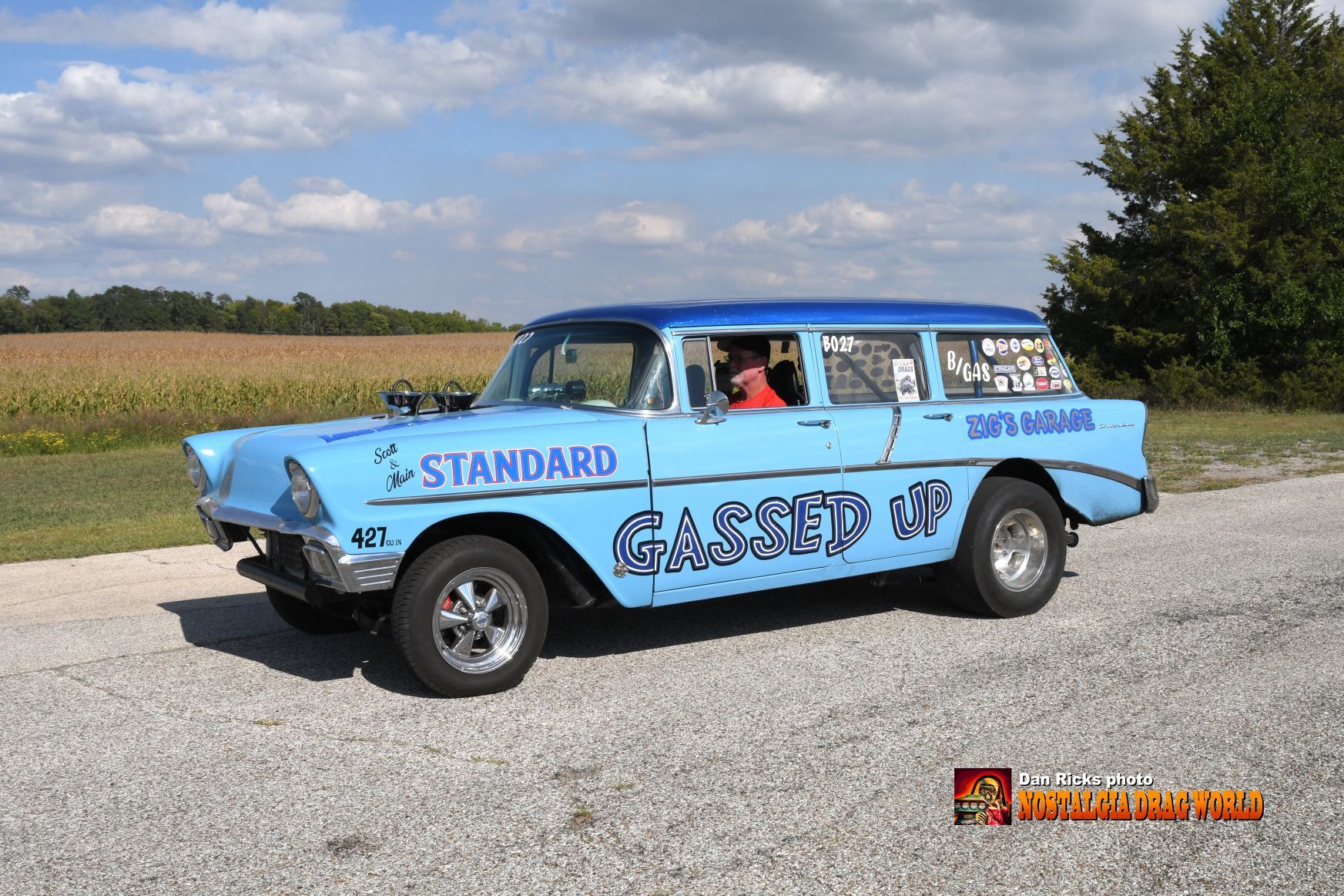 A blue car with the word standard on it
