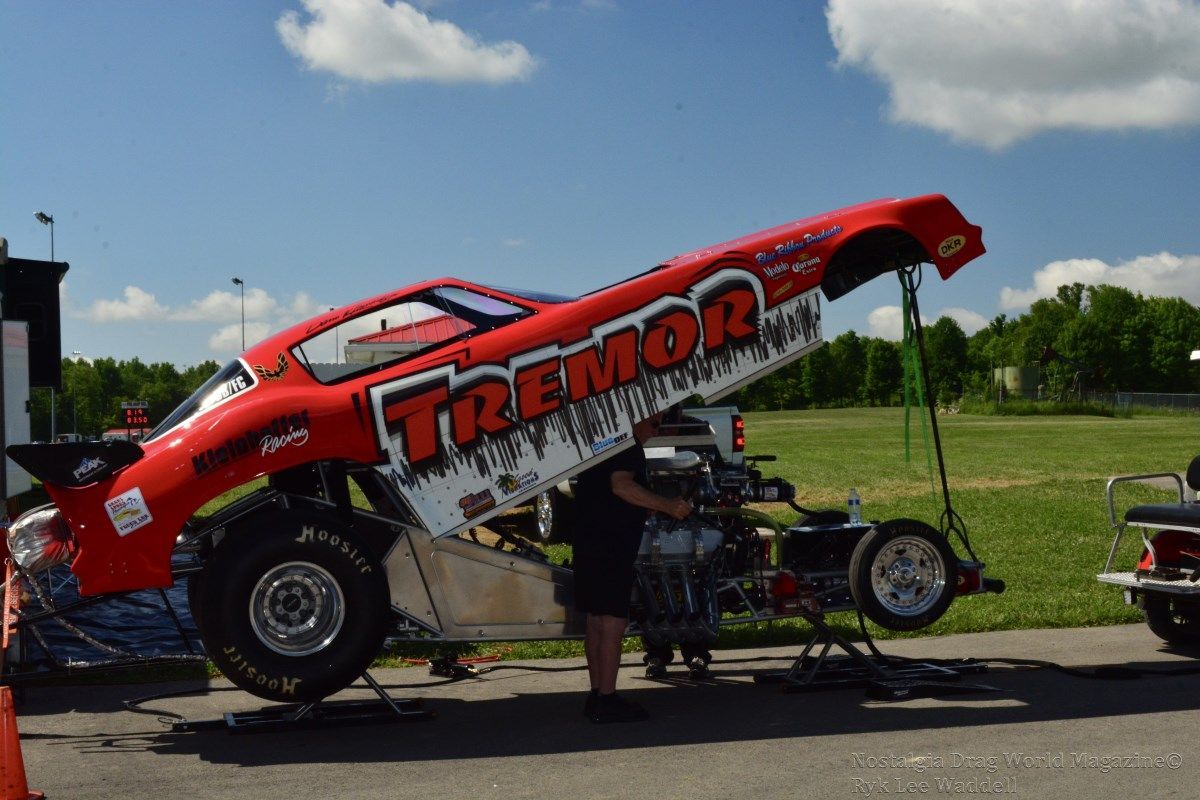 A red race car with tremor written on the side