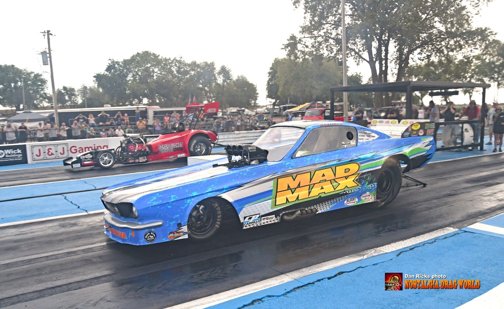 A blue car with the word mar on it