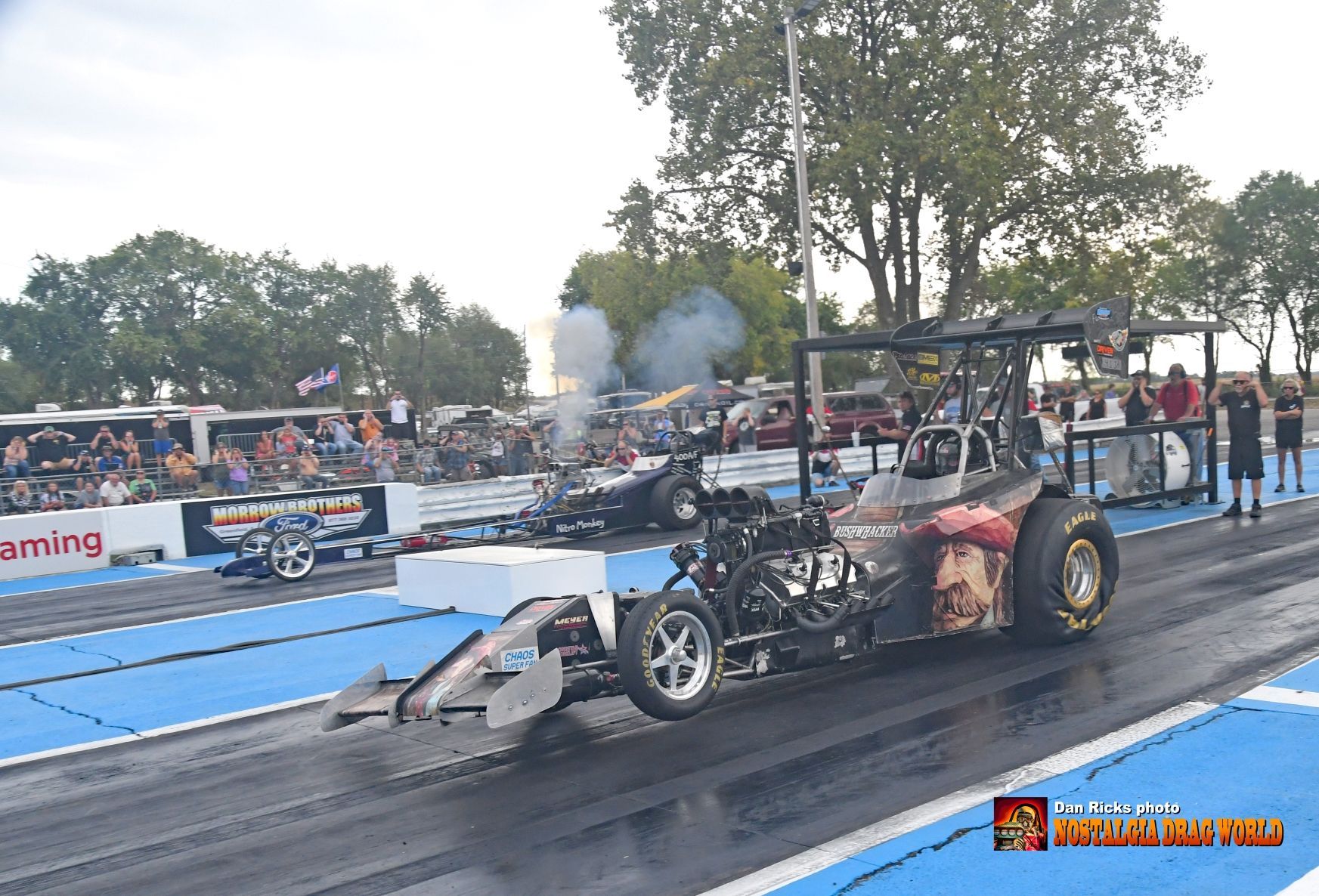 A drag race is taking place on a track.