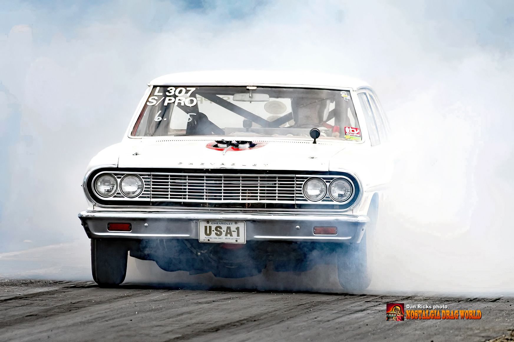 A white car with a license plate that says usa1