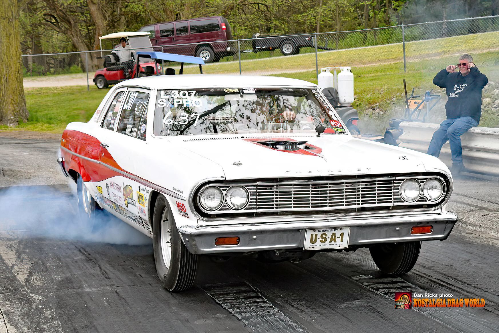 A white and red car with a license plate that says u841