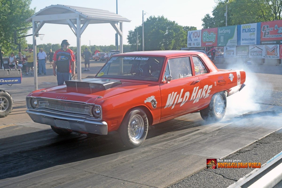 A red car with the word wild race on it