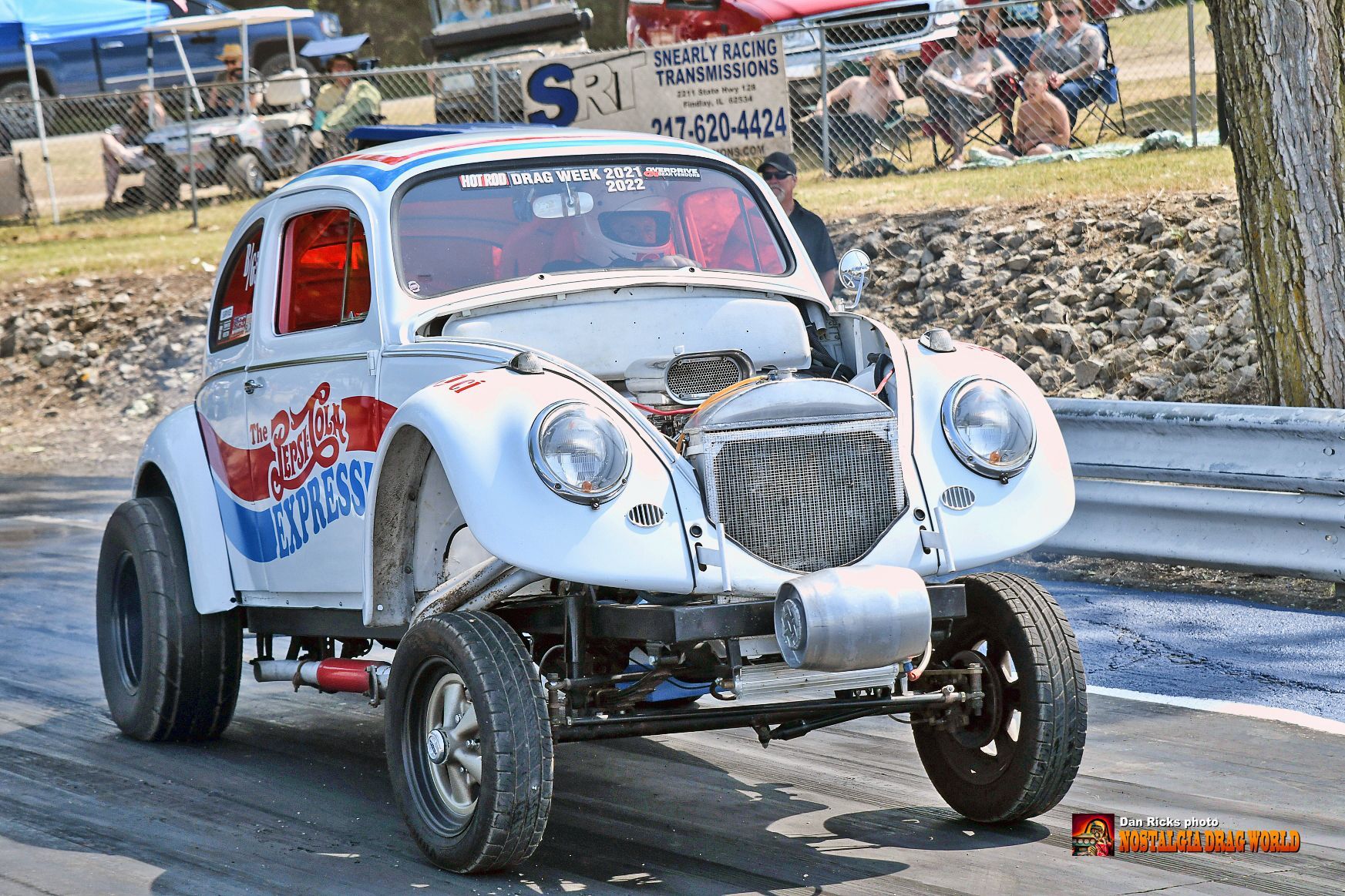 A white car with the word pepsi on it