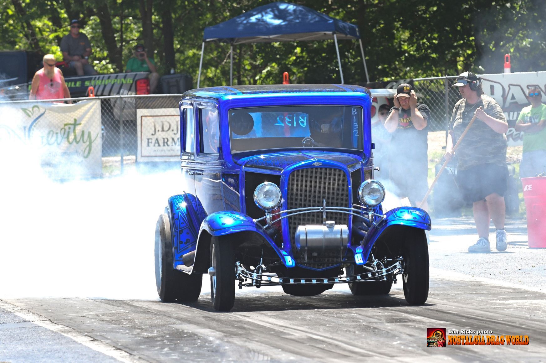 A blue car with the number 1 on the front