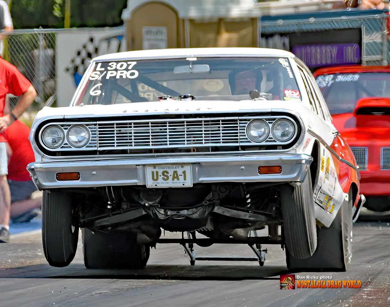 A white car with a license plate that says usa1