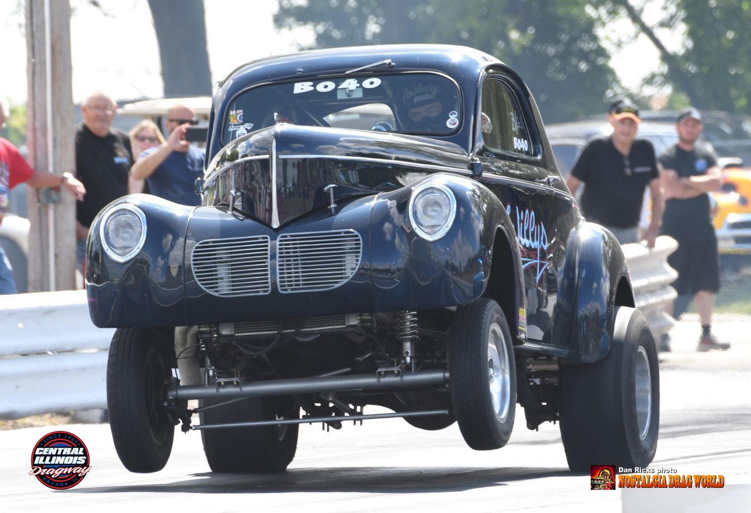 A black car with the word road on the front of it