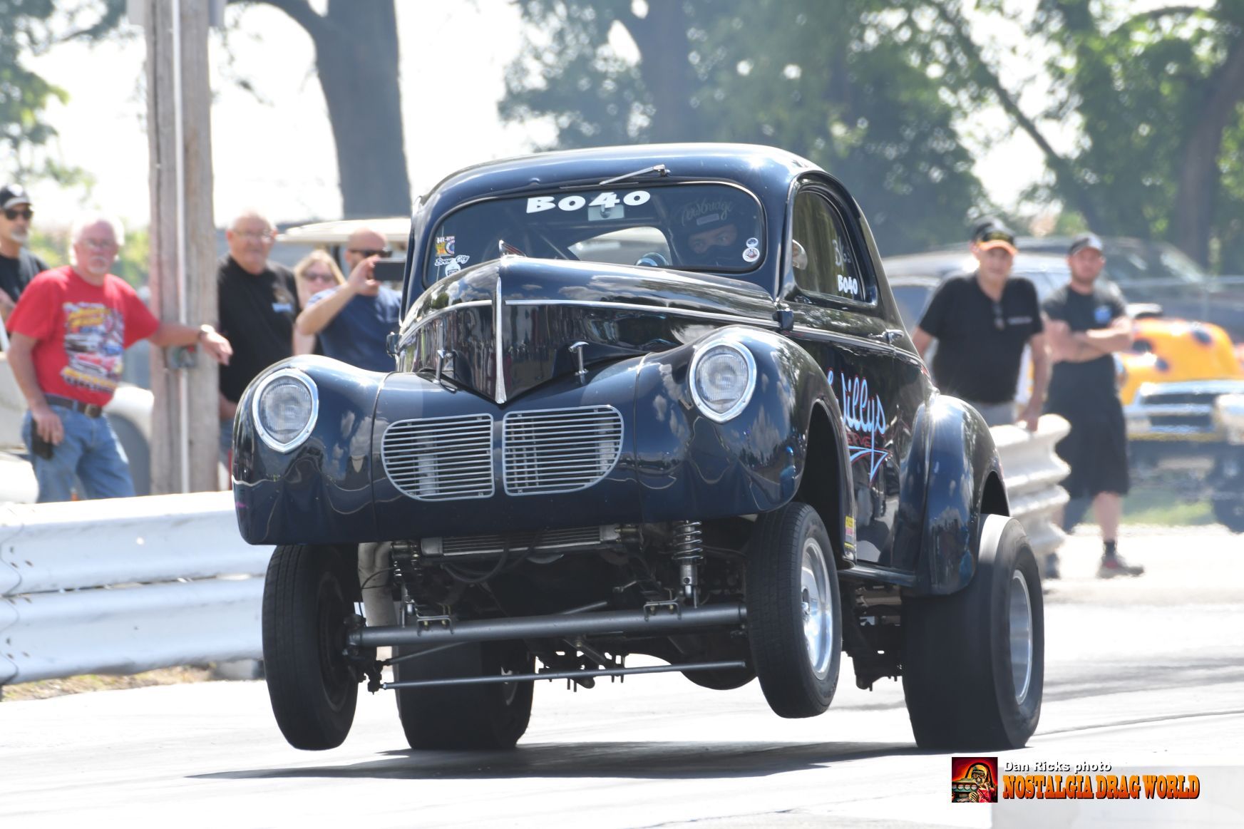 A black car with the word road on the front