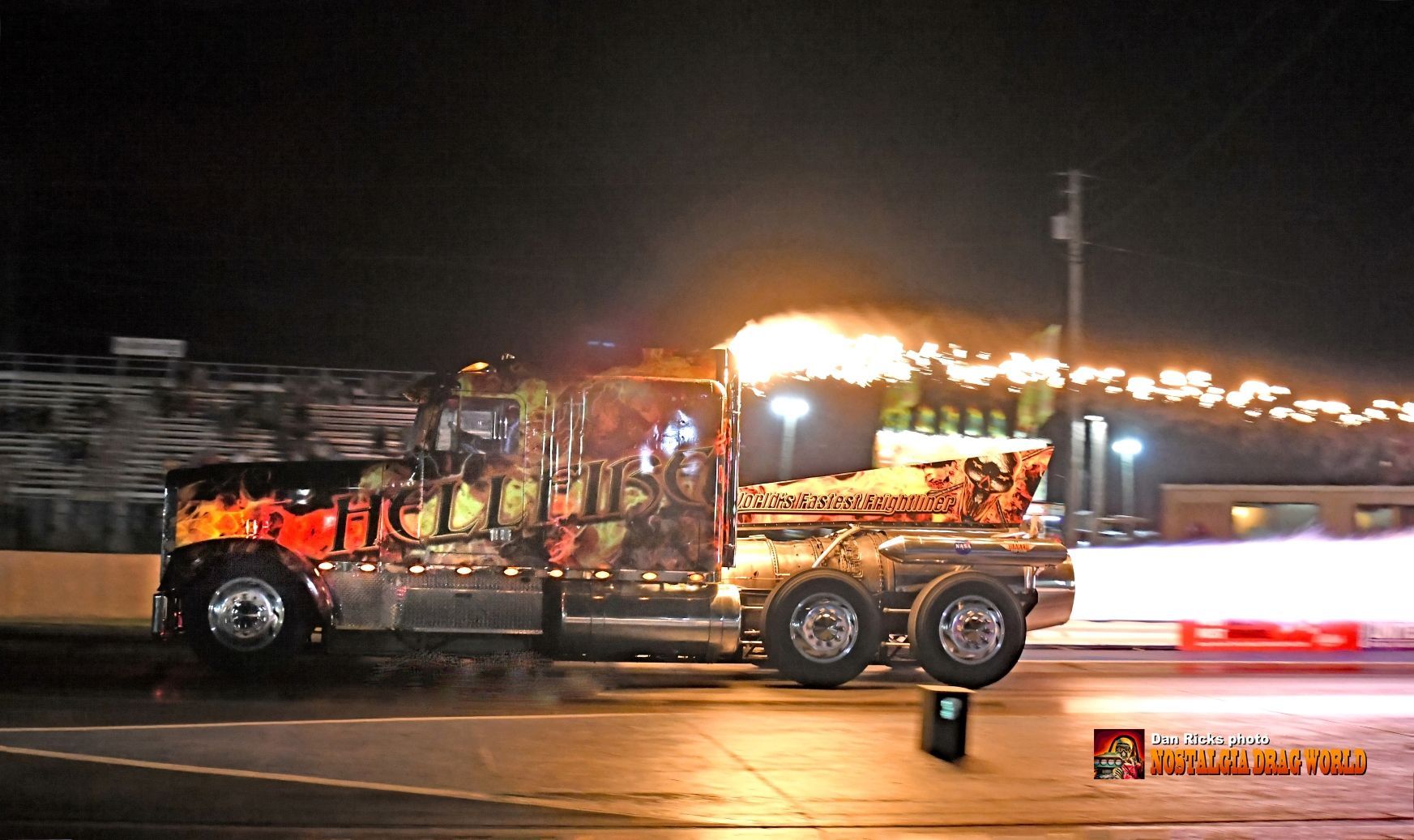 A truck with flames on the side of it