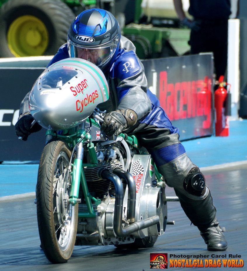 A man is riding a super cyclops motorcycle