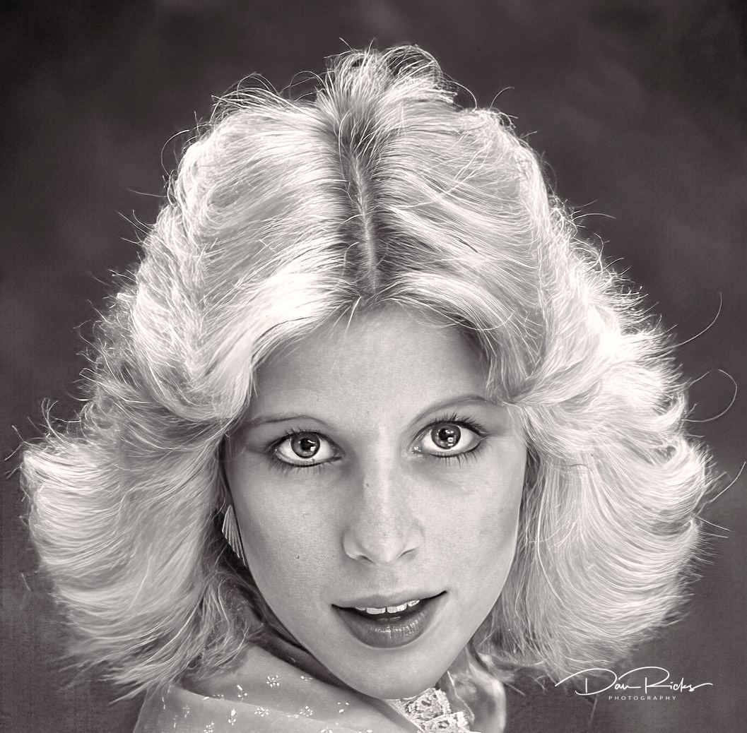 A black and white photo of a woman with blonde hair