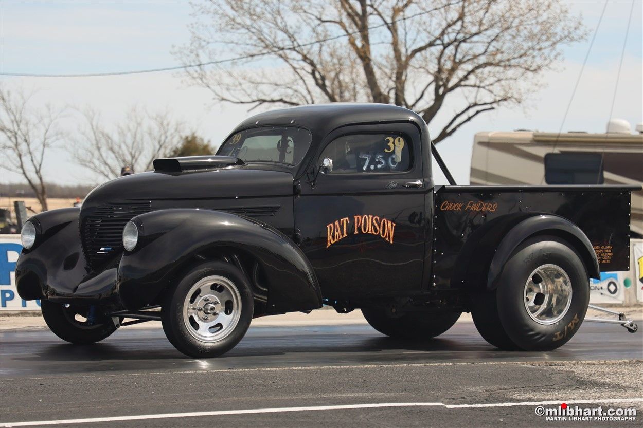 A black pickup truck with the word dirty penny on the side