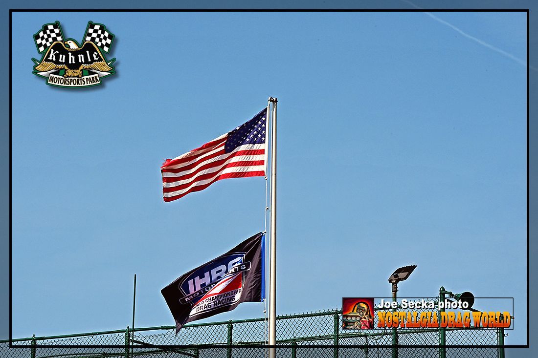 Two flags on a pole with one that says thor on it