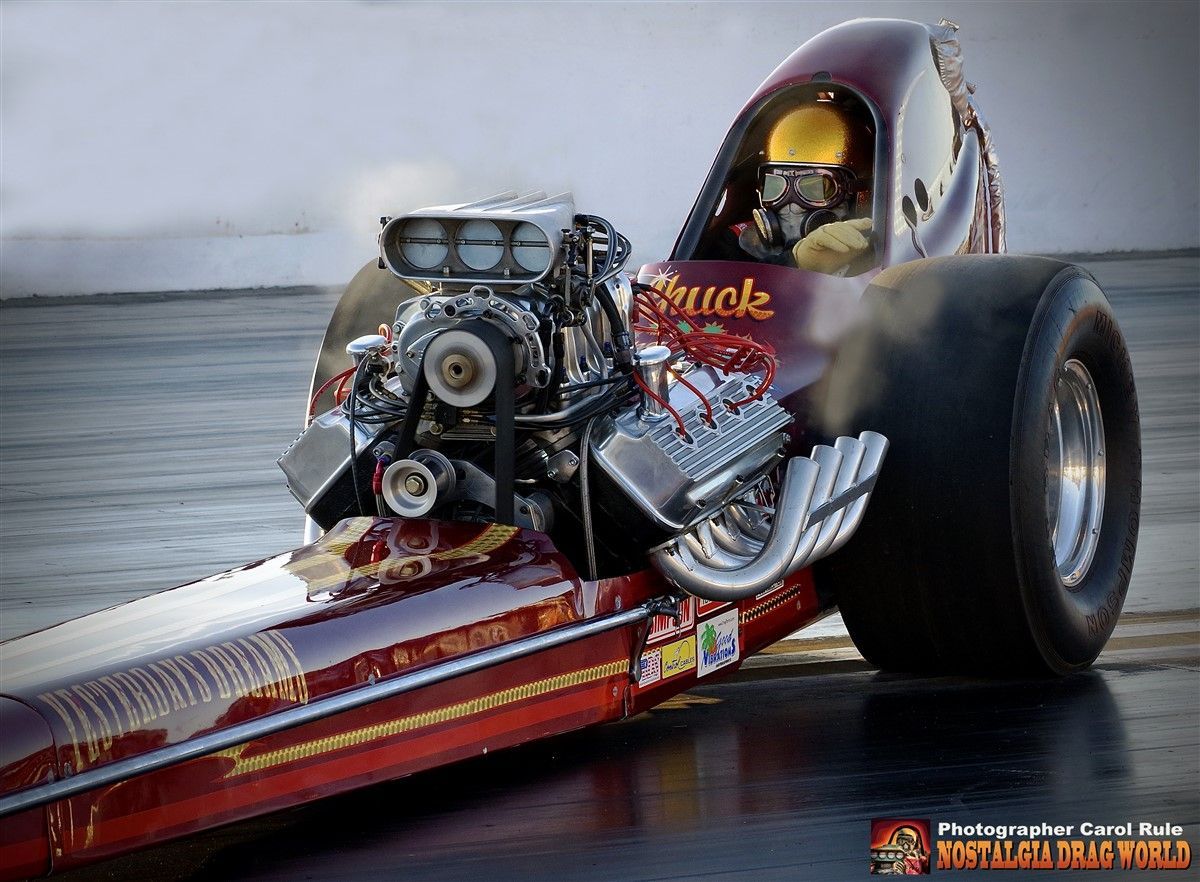 A racing car with the word quick on the side