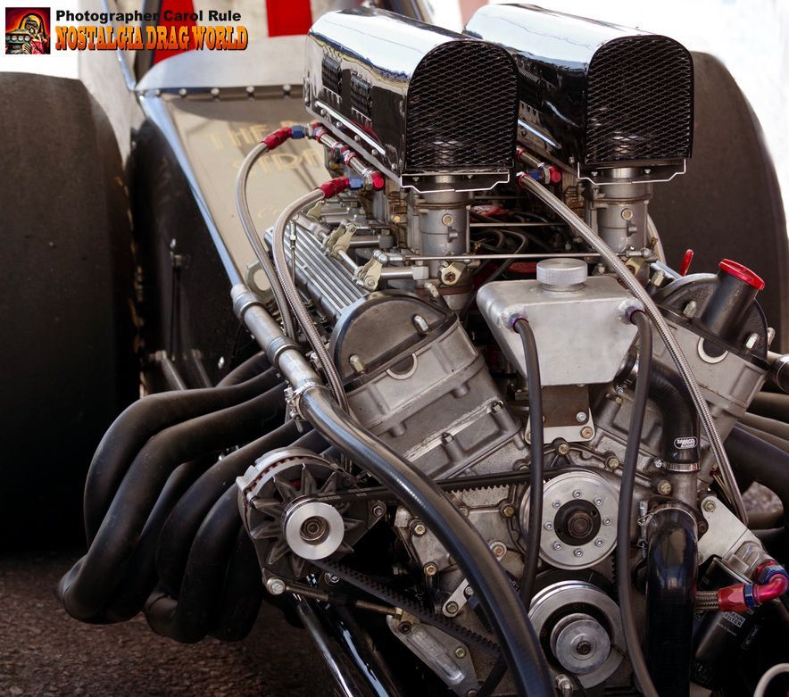 A close up of a race car engine with the word racing world on the bottom right