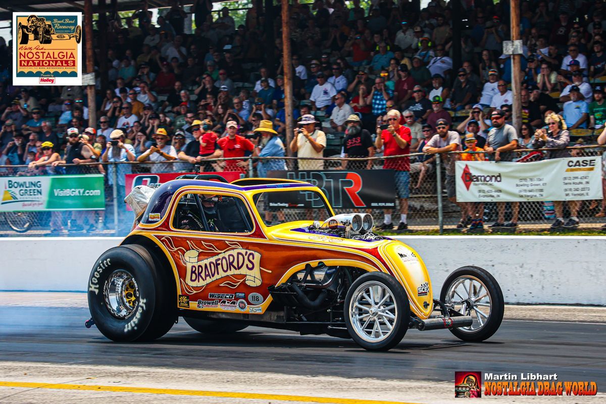 A yellow racing car with the name gunford 's on it