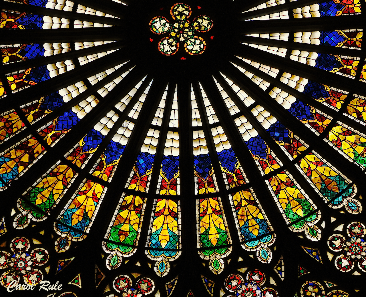 A colorful stained glass window in a church