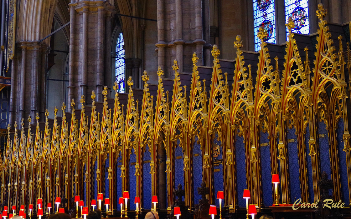 A church with a lot of gold decorations and candles