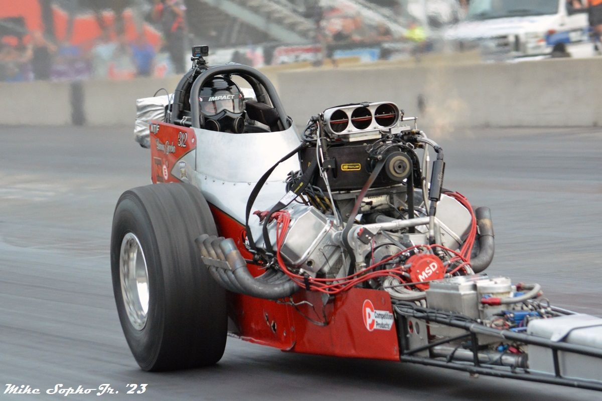 A red and white race car with the number 23 on the side