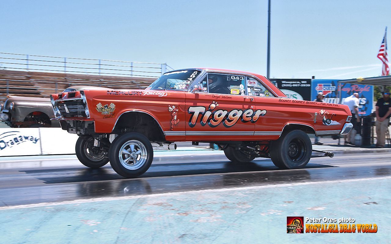 A red car with the word trigger on the side of it