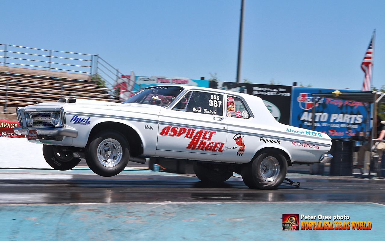 A white car with the word asphalt on it