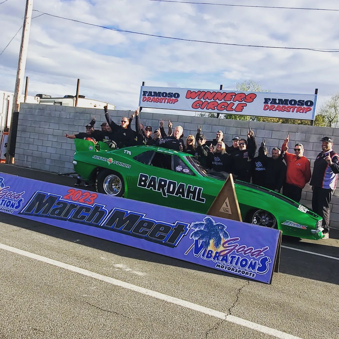 A green race car with the word bardahl on it