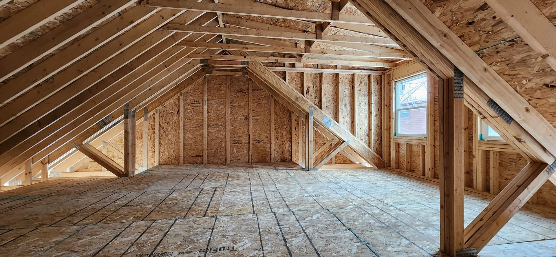 An empty attic in a house under construction.