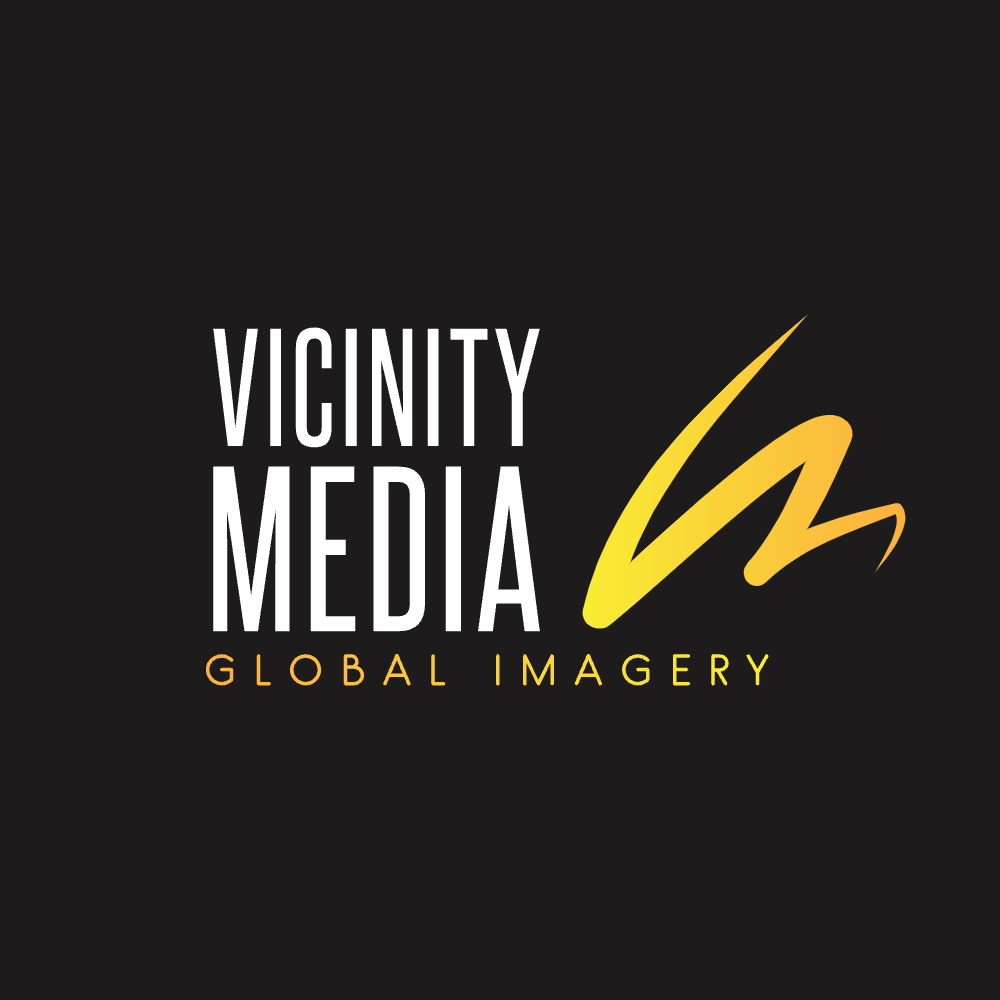Logo for Global Imagery, featuring an abstract, yellow and orange gradient design and text.