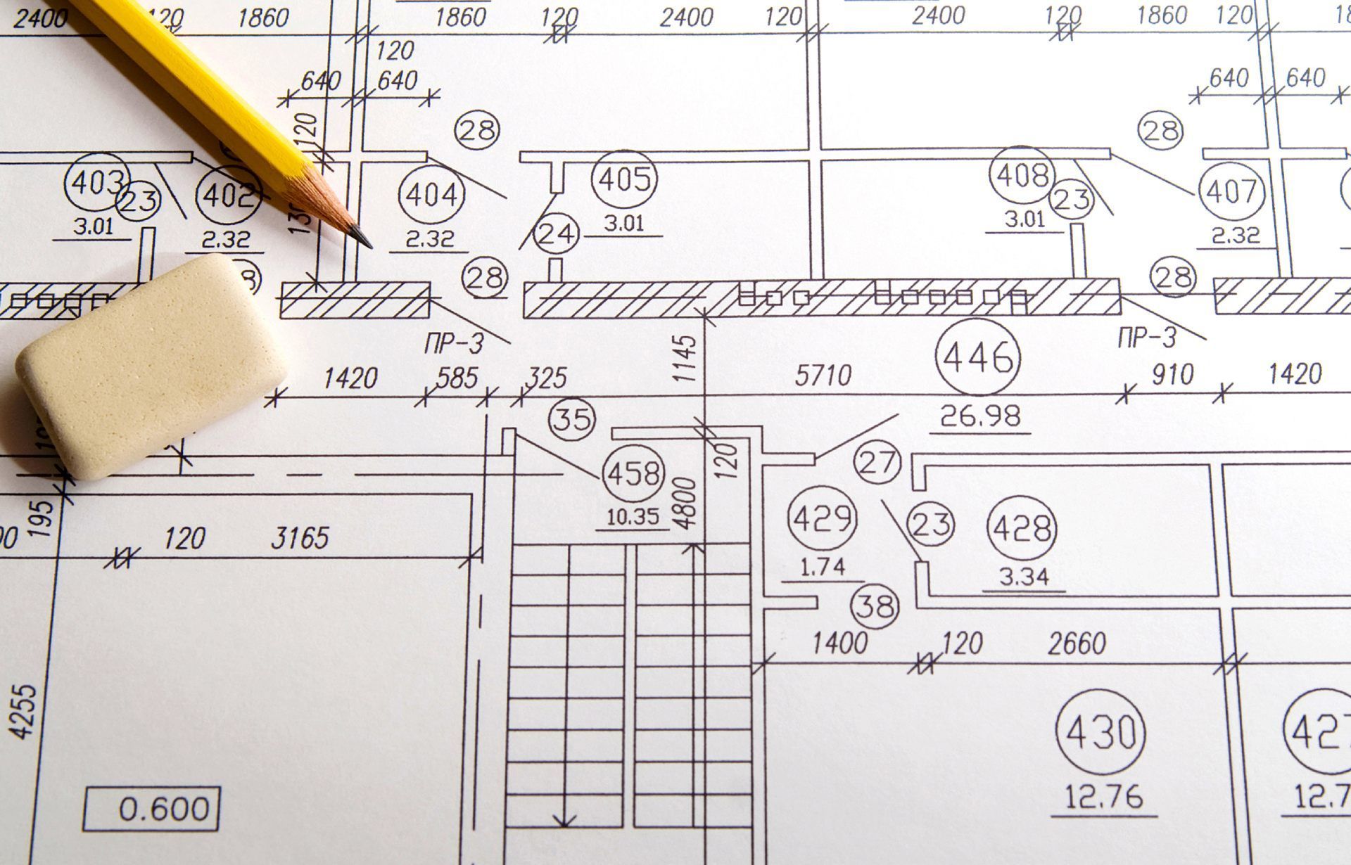 Architectural blueprint with pencil and eraser.