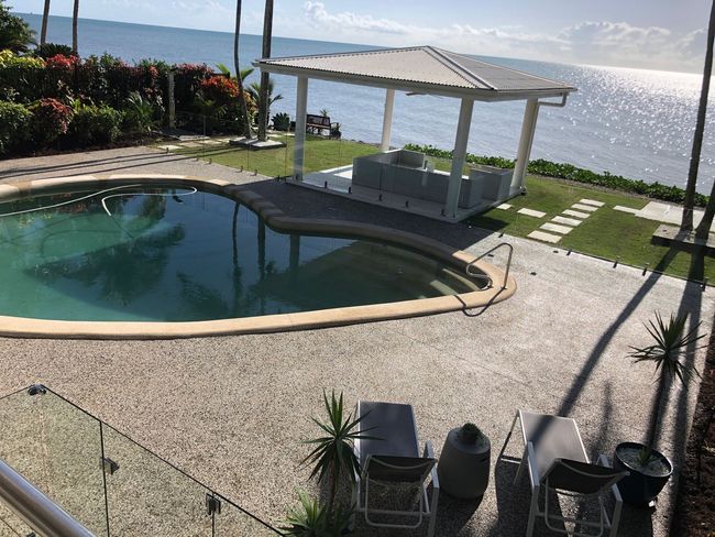 Exposed aggregate concrete to pool and gazebo areas installed