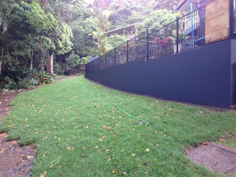 New besser block retaining wall with pool fencing installed