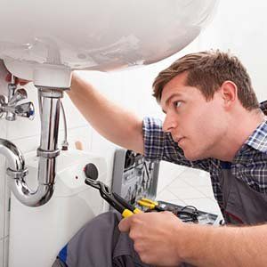 Plumber repairing sinks — Plumbing in Pompton Plains, NJ