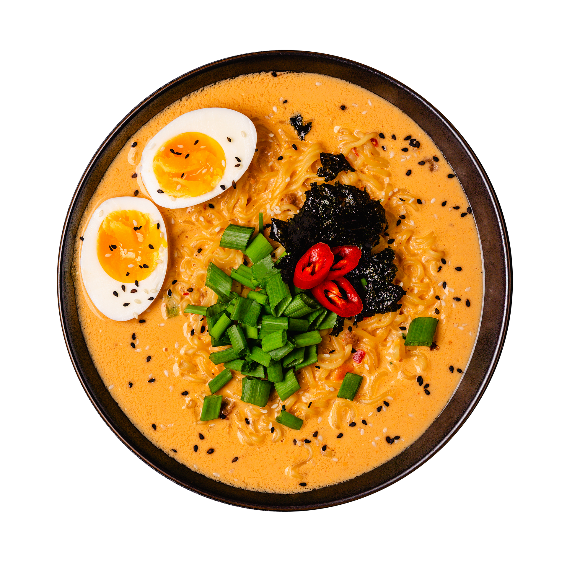 JPOT Japanese hot pot tonkatsu broth with boiled egg, chopped green onions, peppers and seaweed in black bowl bird's eye view