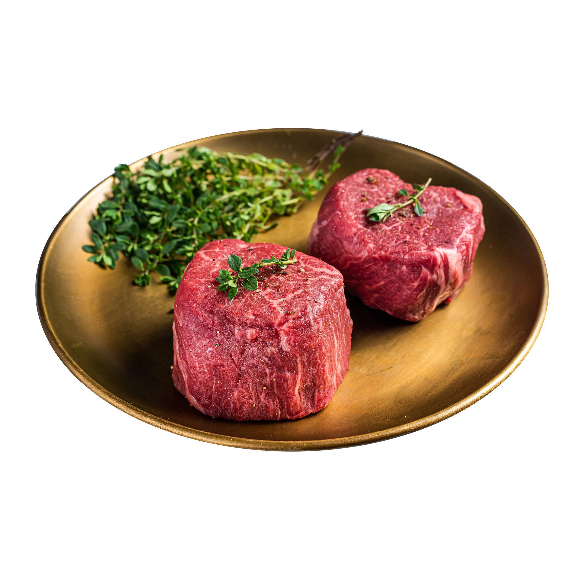 JPOT Japanese BBQ raw filet mignon on a gold plate with herbs angled view