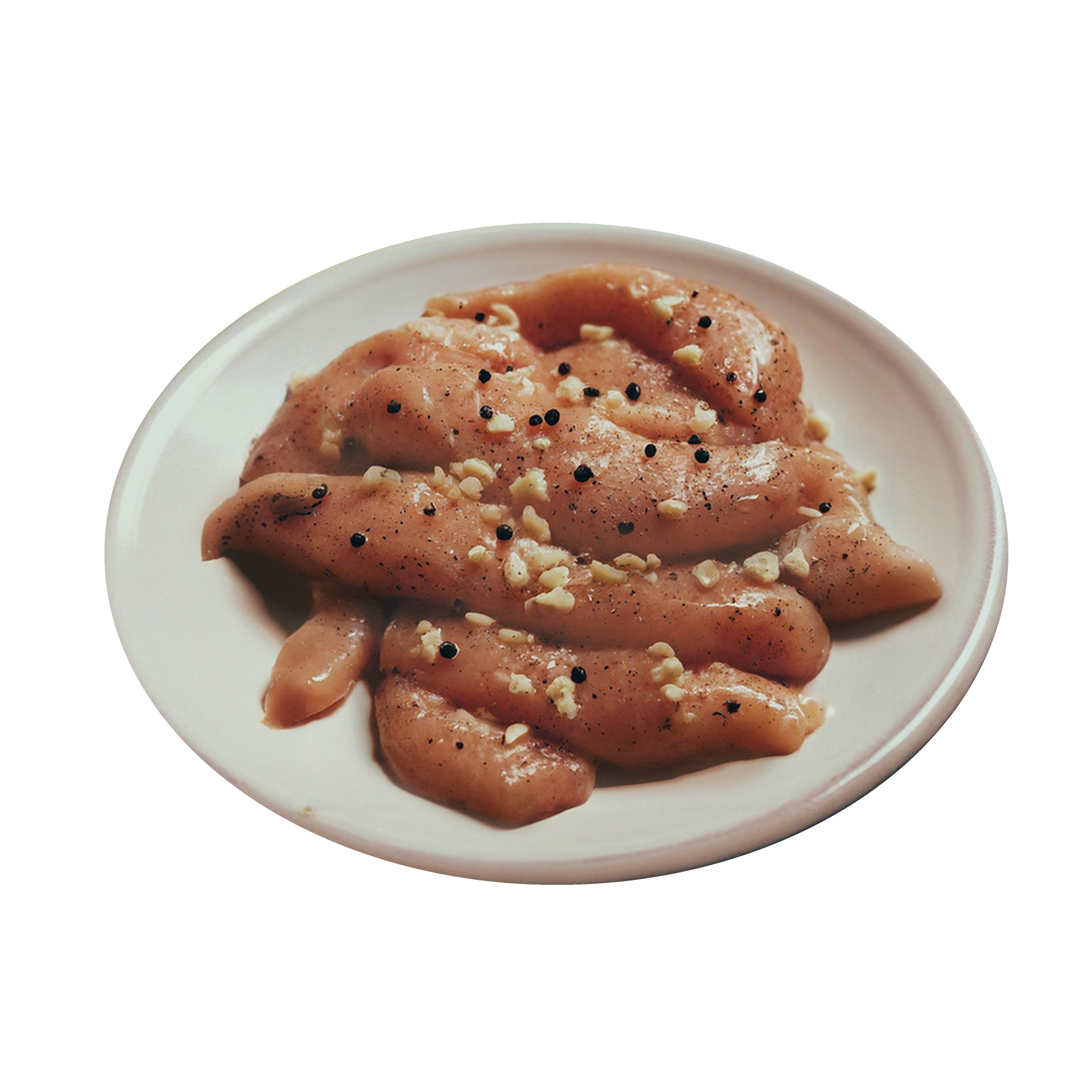 JPOT Japanese BBQ raw garlic chicken on a white plate angled view