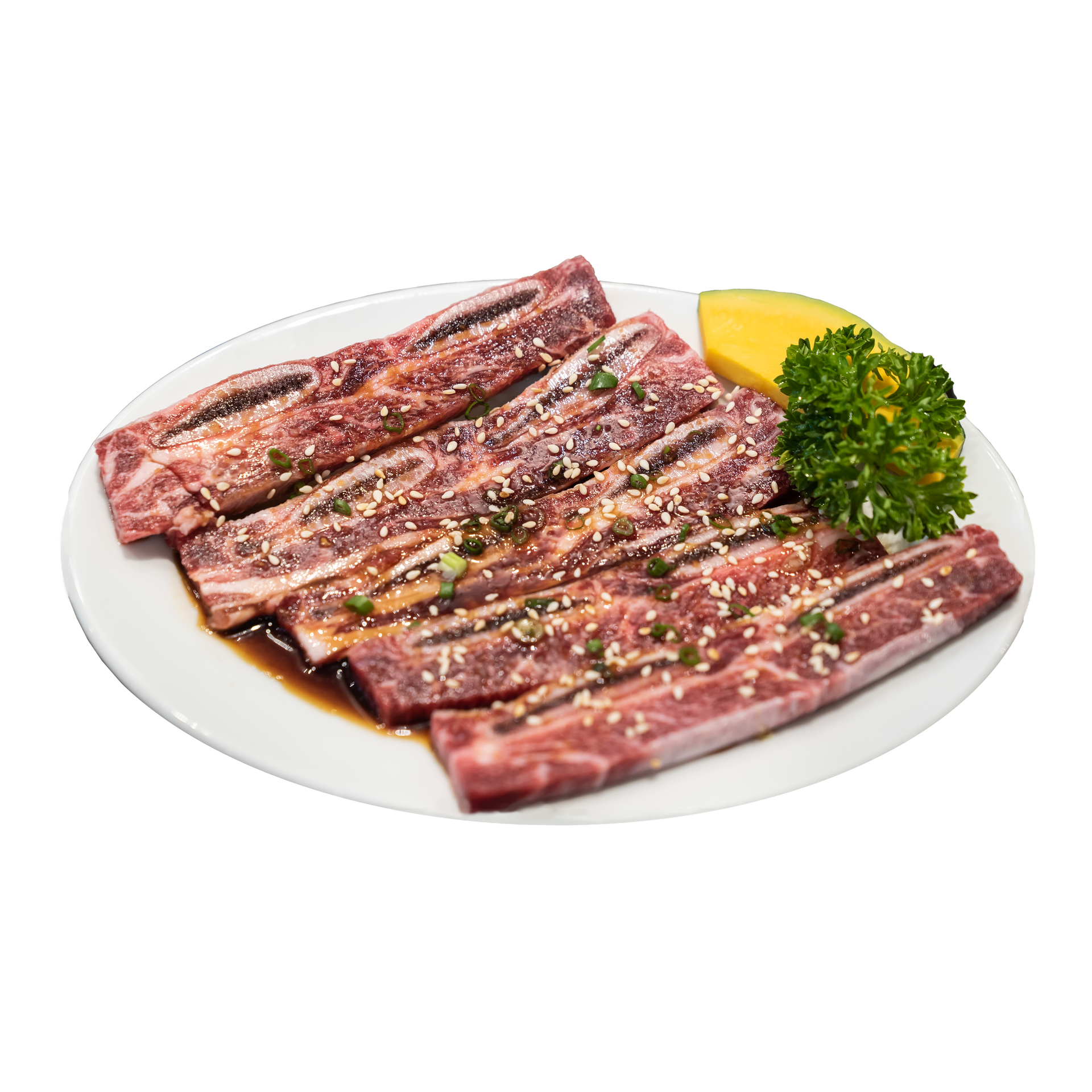 JPOT Japanese BBQ marinated short ribs on a white plate angled view