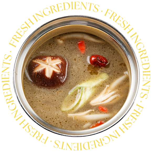 JPOT Japanese hot pot mushroom broth in metal pot with 'fresh ingredient's text circling broth imagery bird's eye view