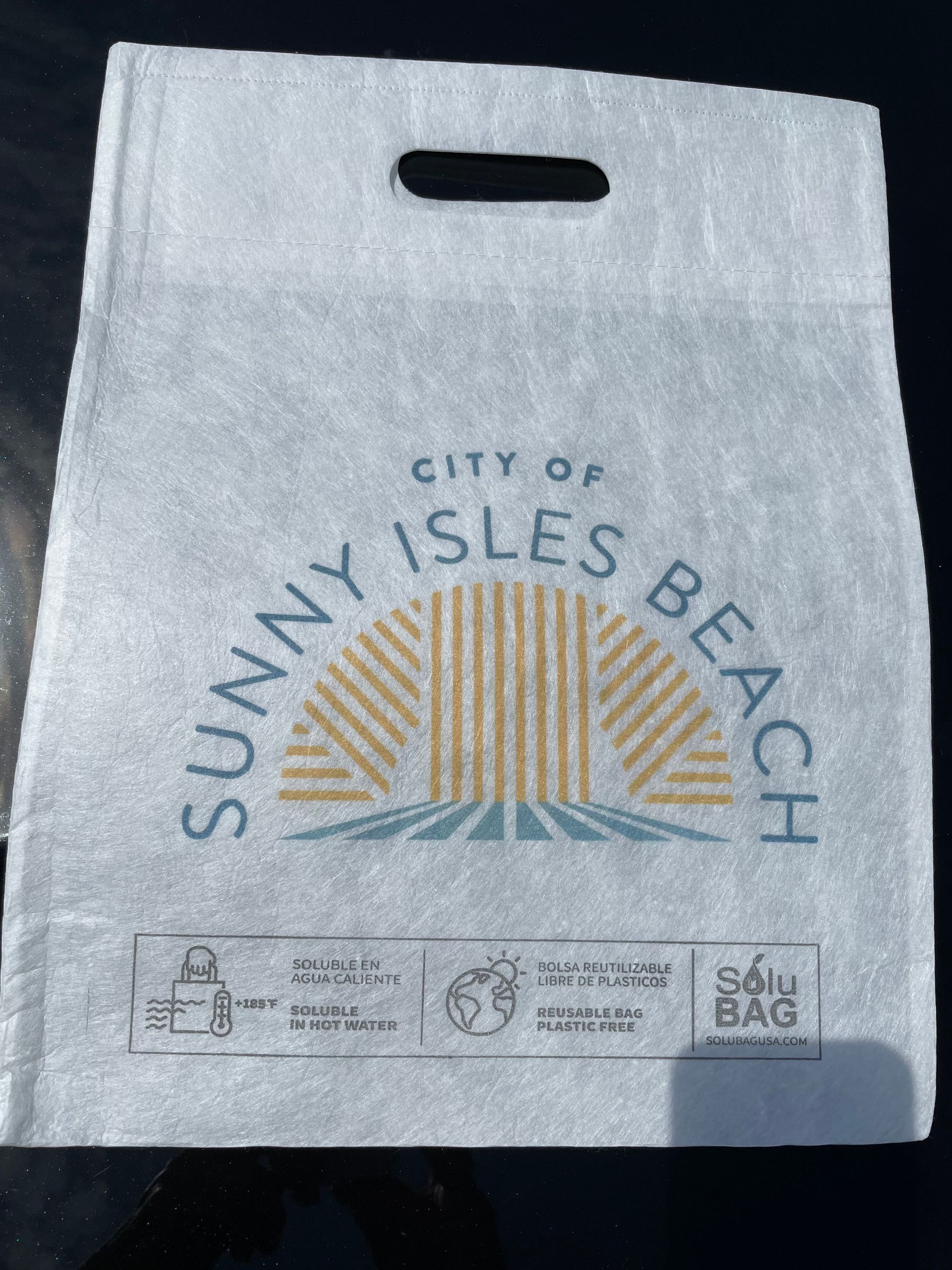 A white bag that says city of sunny isles beach