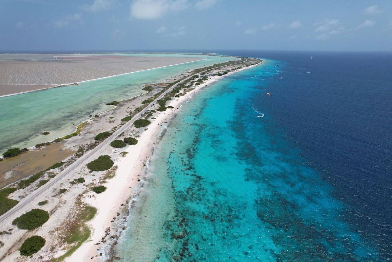 An aerial view of a small island in the middle of the ocean.