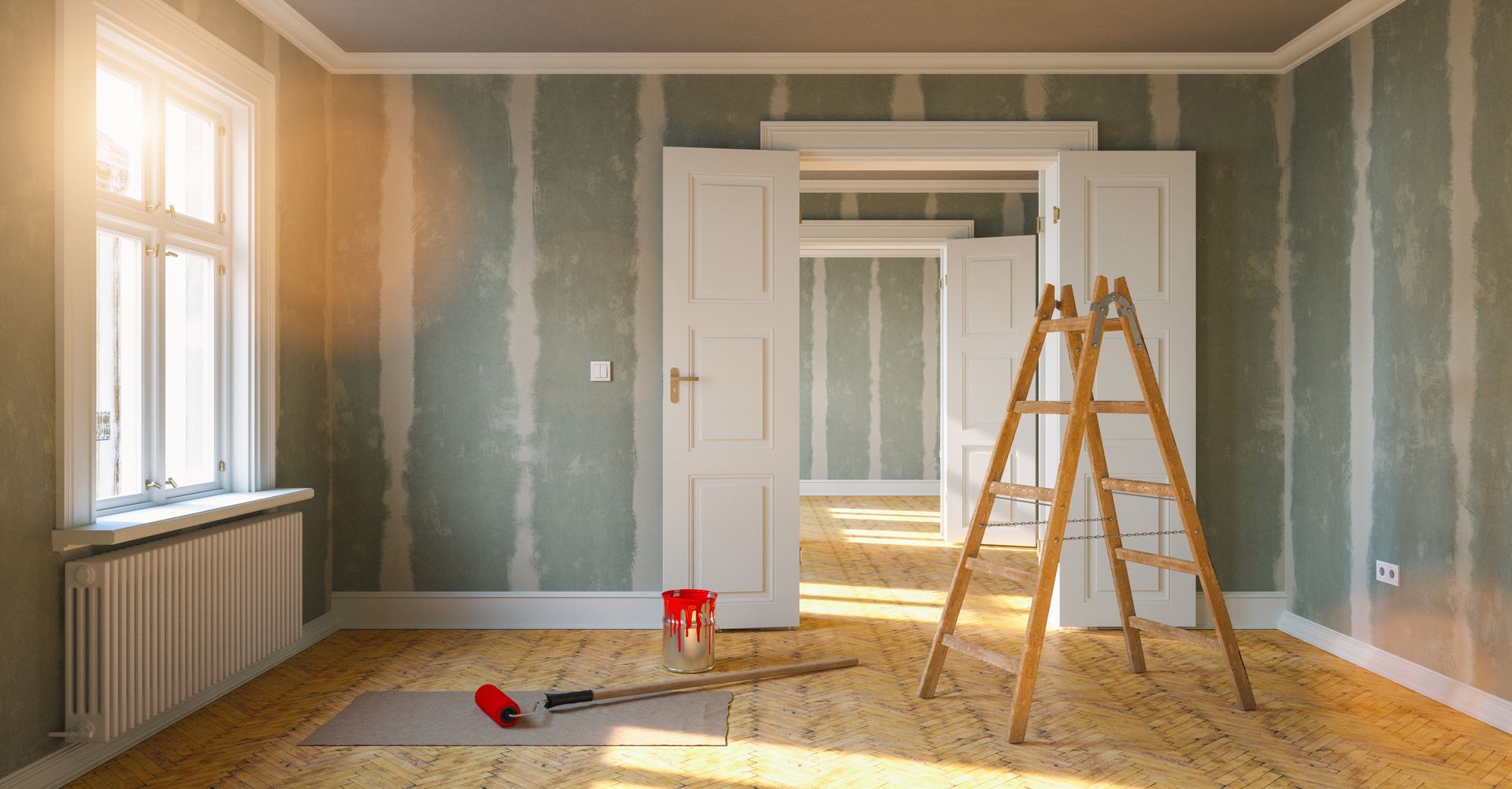 Sunlit empty room under renovation with white doors, paint cans, ladders, and tools on the floor