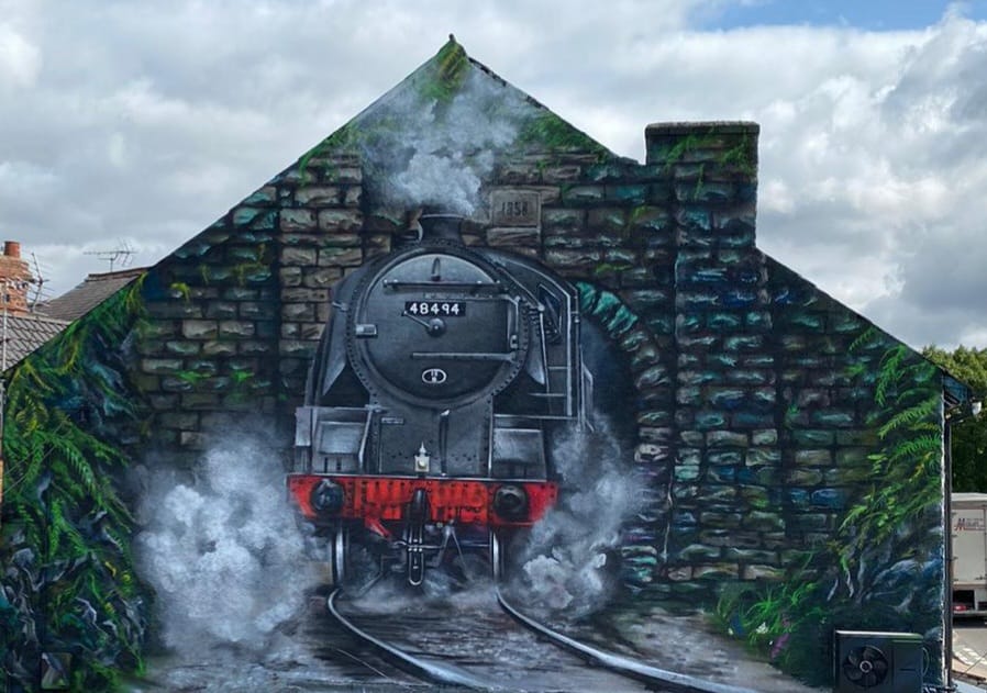 Image of the train painting on the side of a building