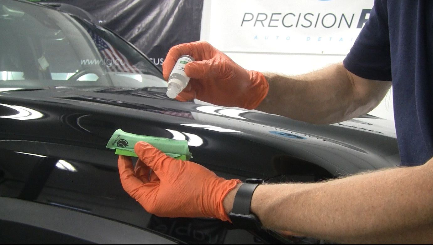 Ceramic coating being applied to applicator