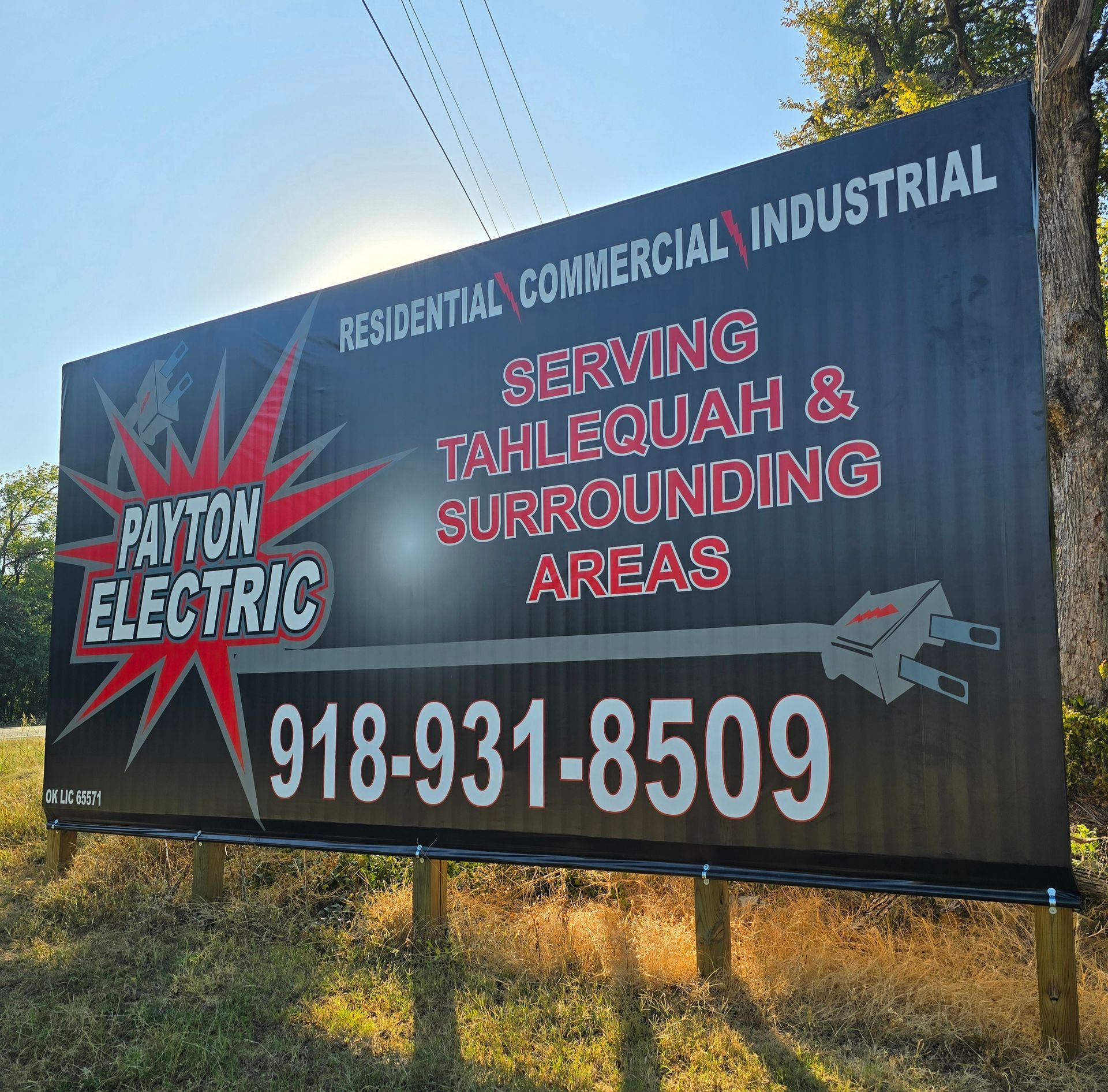 A billboard for payton electric serves residential commercial industrial and surrounding areas