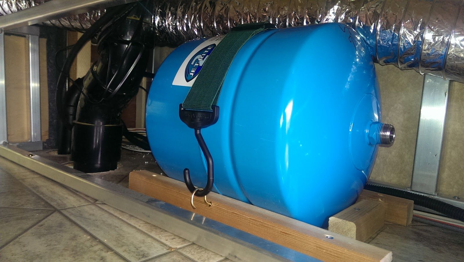 Installation of a reverse osmosis water purification system with pipes and filters.