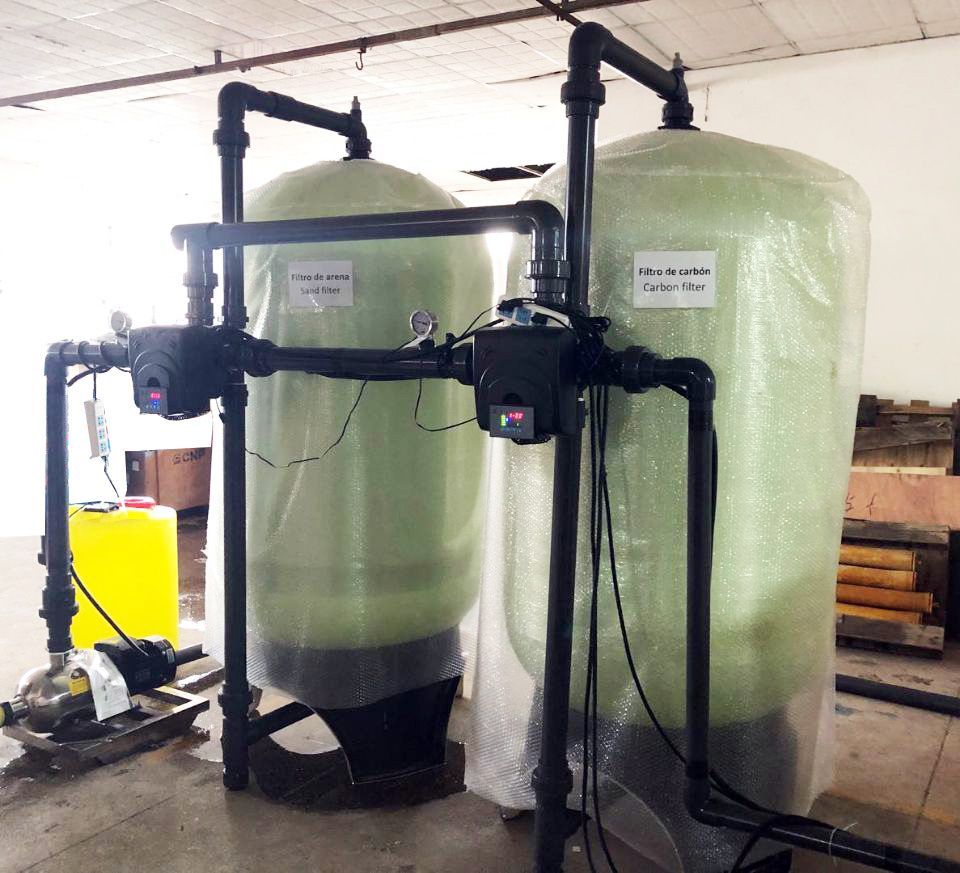 Installation of a reverse osmosis water purification system with pipes and filters.
