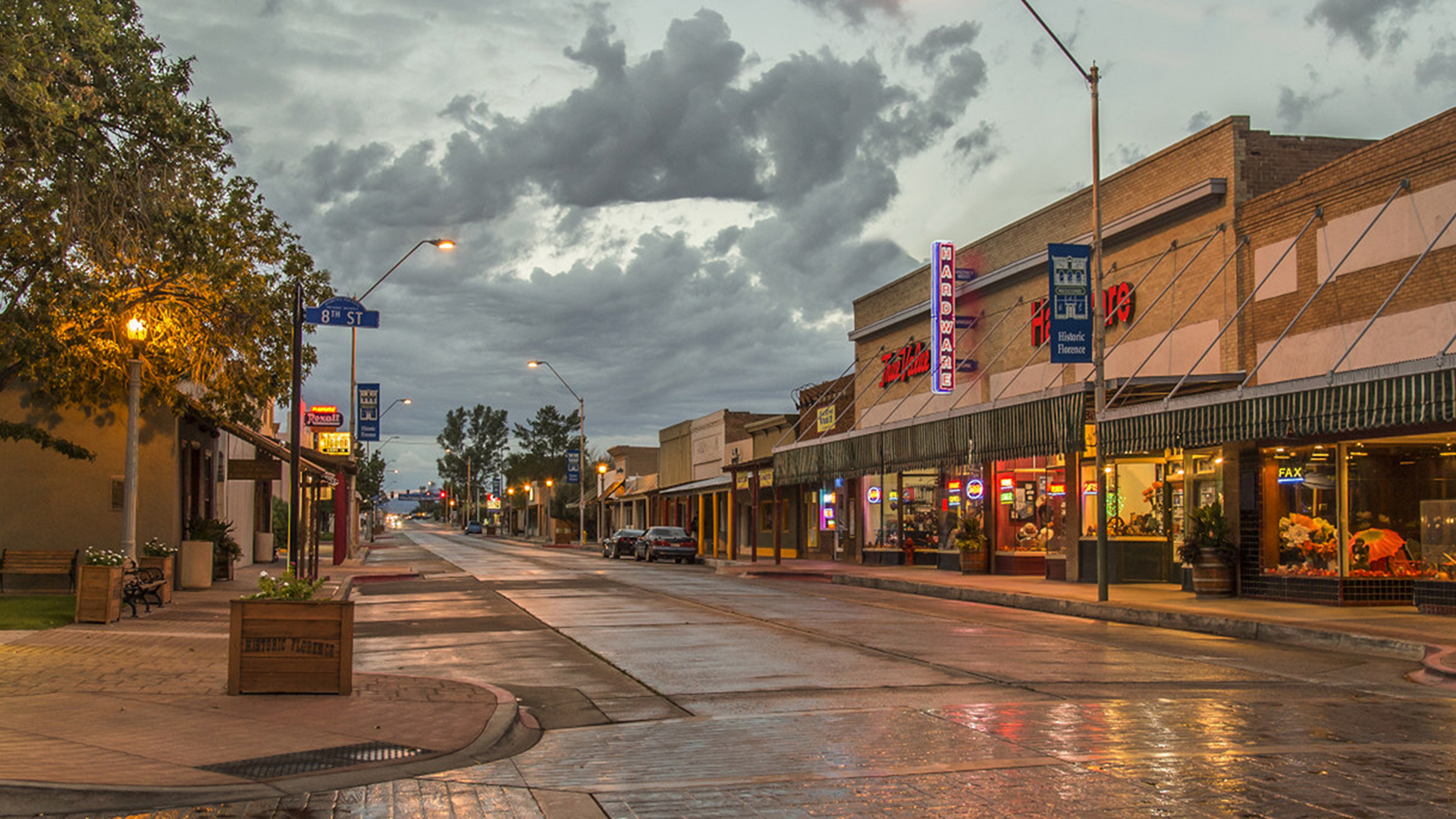 It is a rainy day in a small town with a lot of buildings.