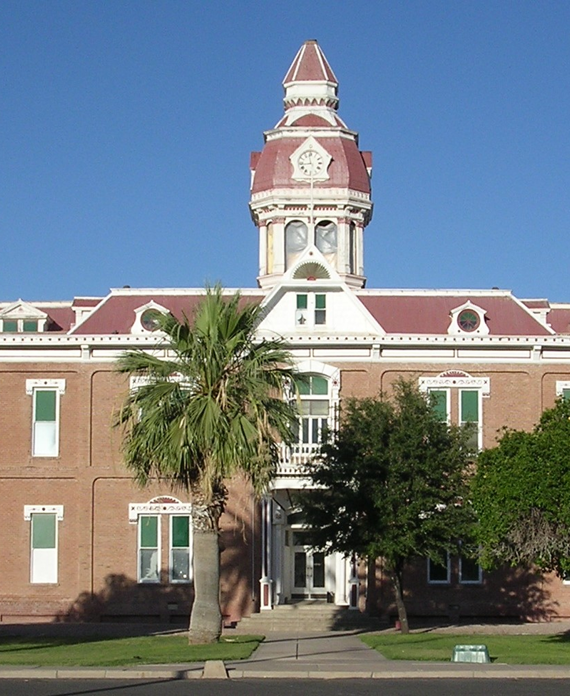 A large brick building with a clock tower on top