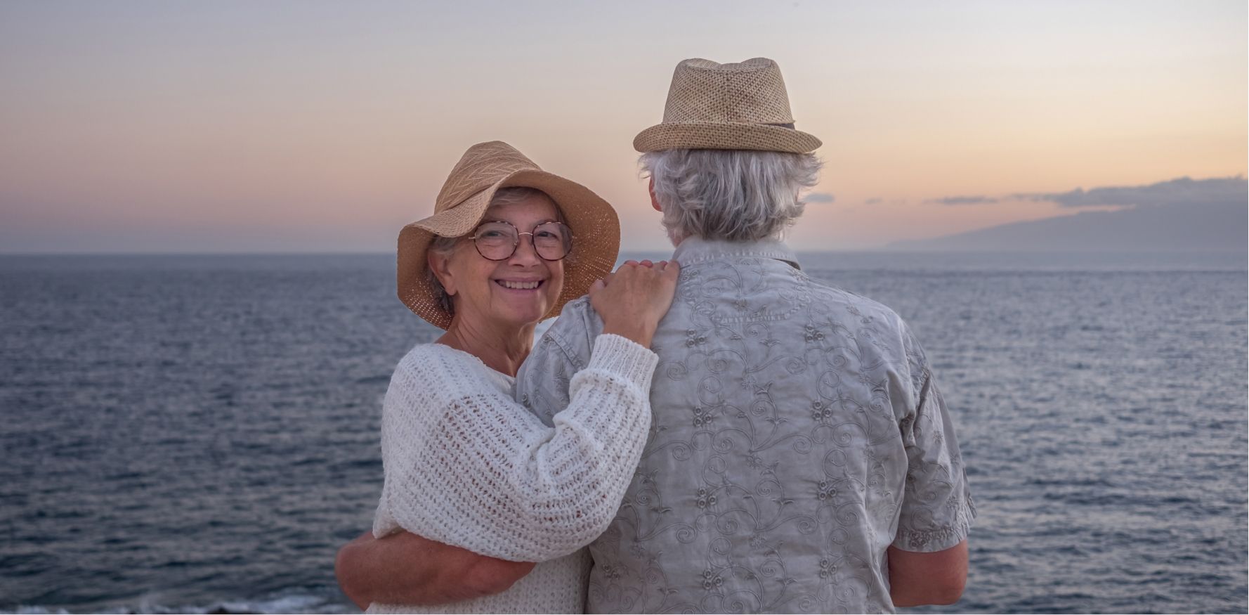 Couple smiling outdoors with 