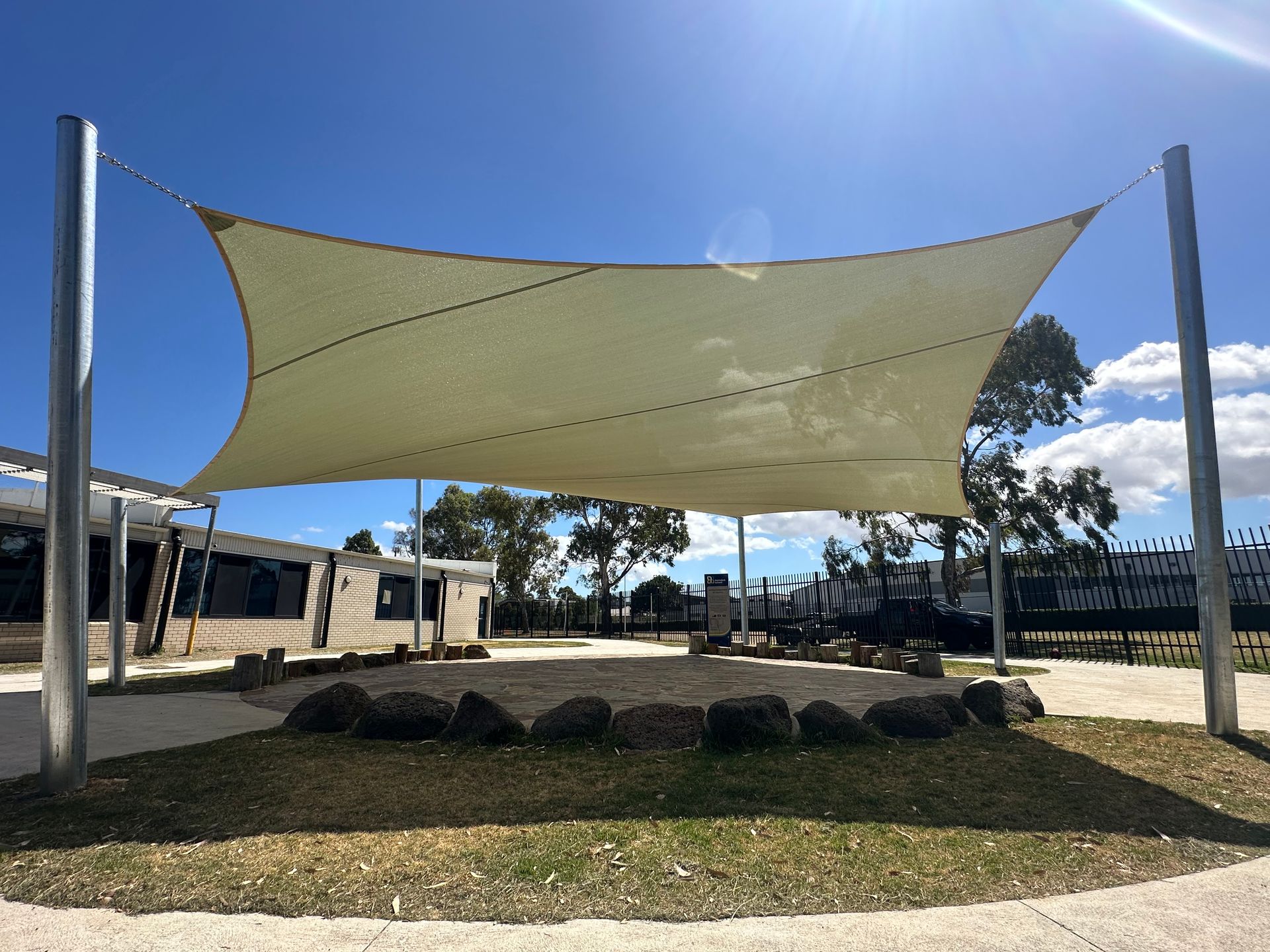 Shade sail installation at Marnebek School Cranbourne — custom outdoor structure by Sundance Shade Structures providing sun protection over landscaped play area