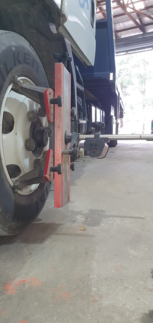 A Truck Is Being Aligned In A Garage — B & W Commercials In Wauchope, NSW